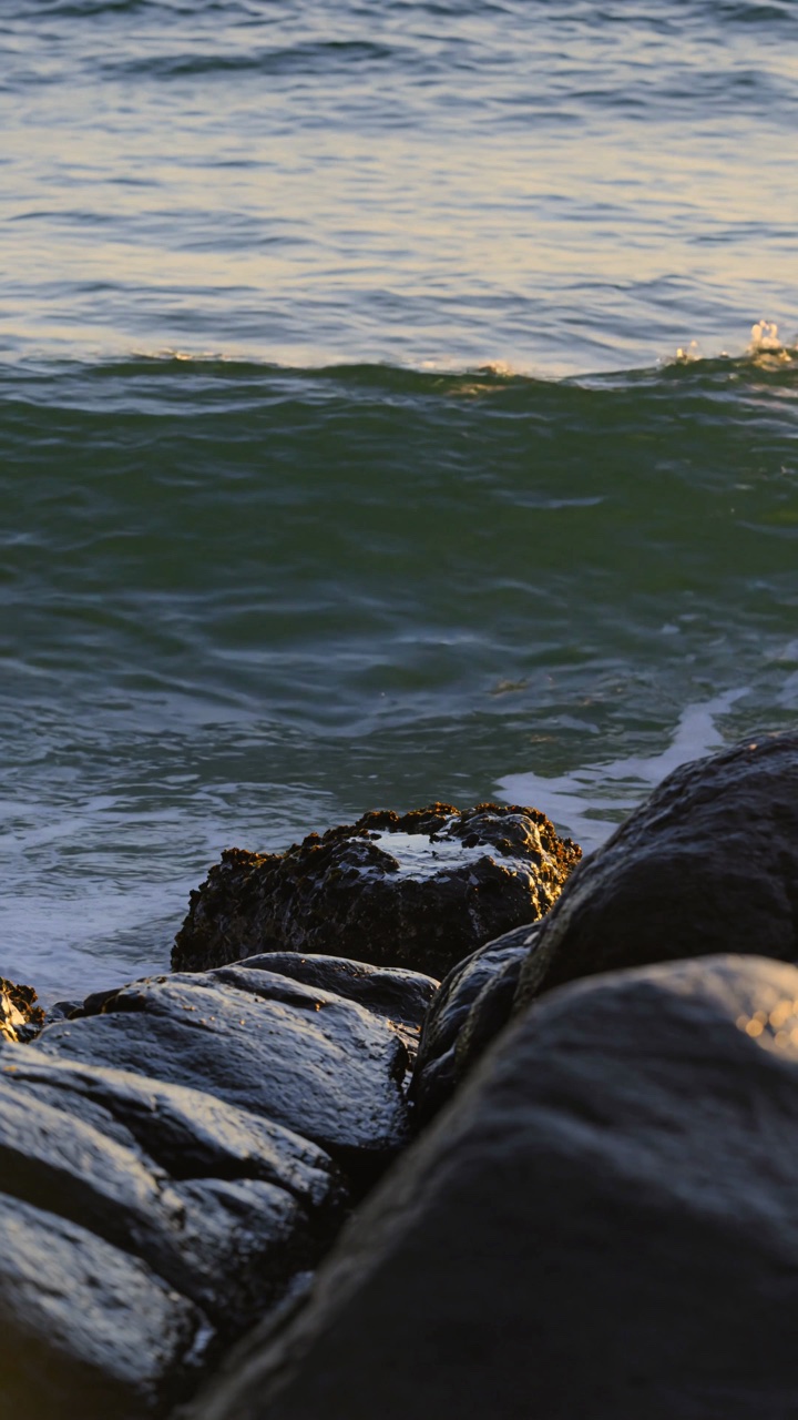 Ocean meeting the rocks at golden hour